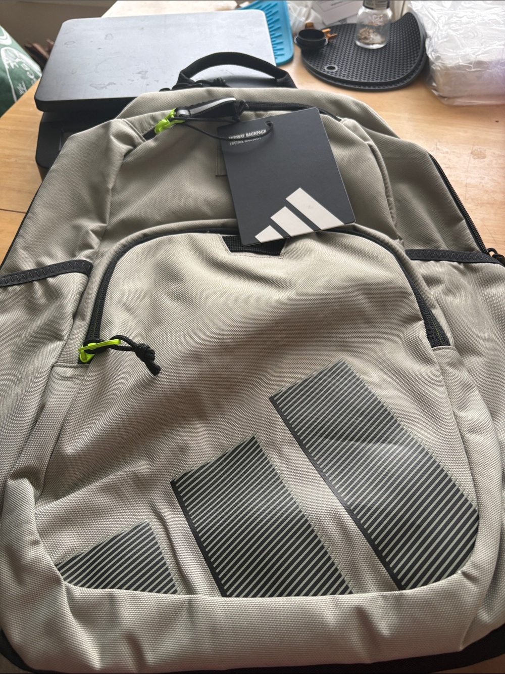 adidas Light Gray Backpack with Black Accents and Neon Green Pulls